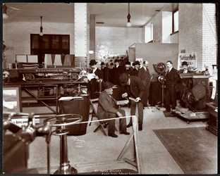 Men at an exhibit of safety devices at the American Institute of Social Service, New York